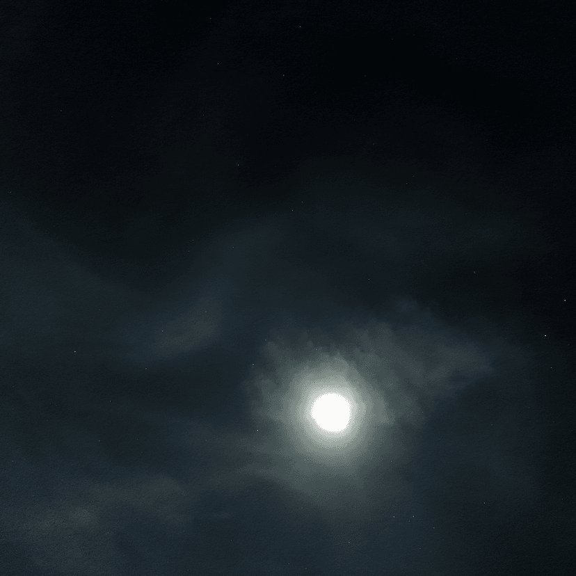 The Moon breaking through drifting clouds over a dark Minnesota sky, captured on a DJI Osmo Pocket 3